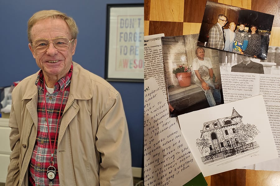 An older man in a beige jacket smiles at the camera. Next to him is a collage of newspaper clippings and photographs.