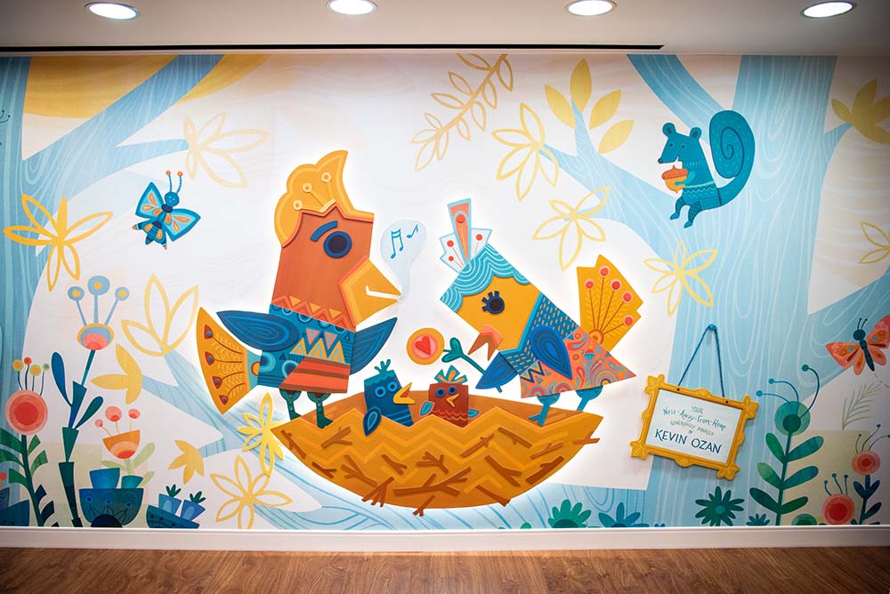 Colorful wall mural with two large birds